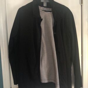 Pant suit with shirt, pants, and button up jacket.